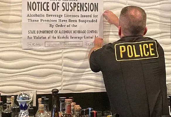 A police officer suspends a bar after an RBS incident involving alcohol.
